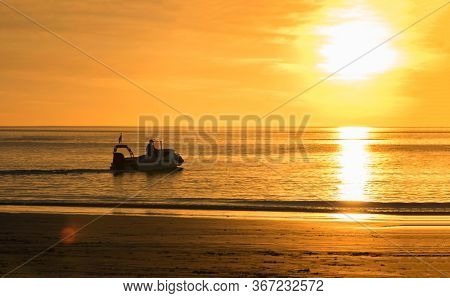 Western Australia â Silhouette of a boat at the sunset evening light on Cable Beach in Broome