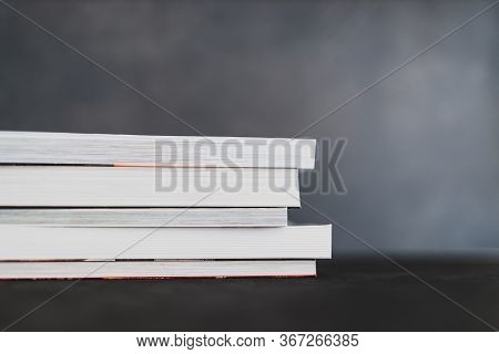 Stack Of Books Shot From Eye Level With Shallow Depth Of Field.