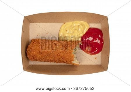 Partly Eaten Brown Crusty Dutch Kroket With Mustard And Ketchup Isolated On A White Background