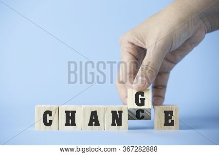 Woman Hand Hold Wooden Cube Word On Business Blue Background Concept For Change Mindset To Building 