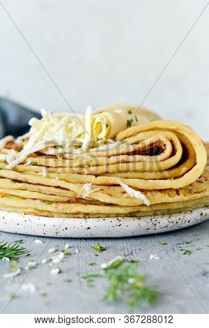Norwegian Potato Pancakes Lefse On A Light Background With Cheese And Greens. Traditional Scandinavi