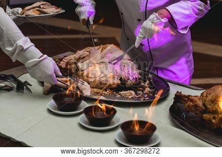 Appetizing Grilled Meat On Fire Close-up. Beautiful Presentation Of The Dishes In The Restaurant