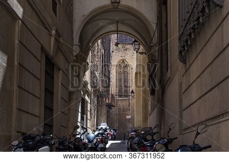 Barcelona, Spain - May 15, 2017: View From The Back Narrow Street To The Gothic Basilica Of Saints J