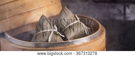 Rice Dumpling, Zongzi - Chinese Rice Dumpling Zongzi On Black Brick Background Slate Table, Concept