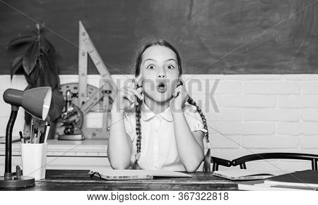 Girl Cute Child Sit School Classroom Chalkboard Background. Small Kid Study School. Knowledge Day. A