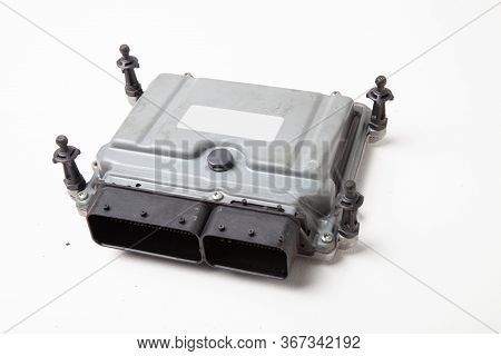A Plastic Car Engine Control Unit With Metal Elements On A White Isolated Background Is The Back Cen