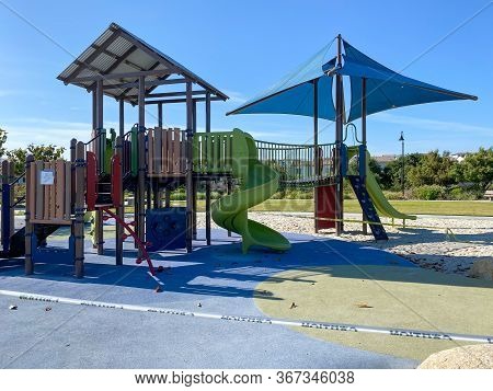 Closed Community Park With Playground For Kids Due To Covid 19. Coronavirus Virus Panic And Quaranti