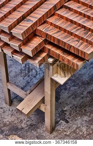 Joinery. Wood Veneer Wall Panels Elements Are Covered With Dust. Rosewood Reconstituted Veneer. Furn