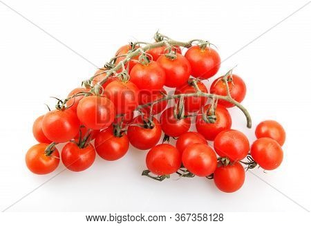 Fresh Organic Cherry Tomatoes Isolated On White Background. The Cherry Tomato Is Regarded As A Botan