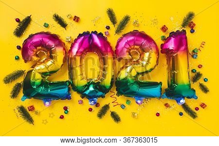 Rainbow colored Foil balloons in the form of numbers 2021. New year celebration