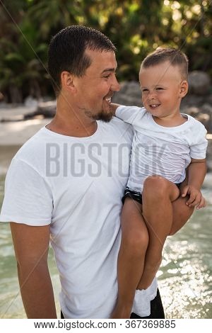 Happy Smile European Family Have Rest And Run On White Sand Beach