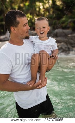 Happy Smile European Family Have Rest And Run On White Sand Beach