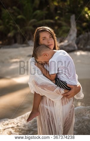 Happy Smile European Family Have Rest And Run On White Sand Beach