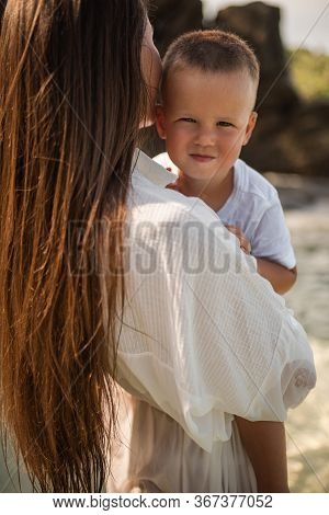 Happy Smile European Family Have Rest And Run On White Sand Beach. Father, Long Black Chestnut Hair 