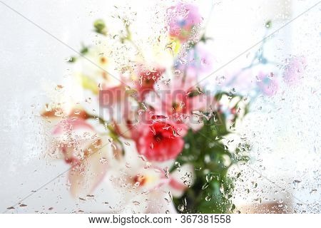 Beautiful Wallpeper Of A Flower Bouquet Standing Behind A Window Covered With Fresh Rain Drops
