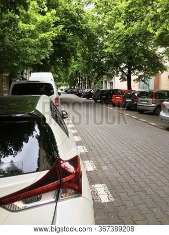 Close Up Back Of 2 Cars Parking On The Road And Under Tree