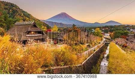 Mt. Fuji, Japan autumn landscape with historic japanese village.