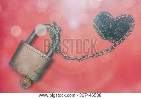 Conceptual Image With A Heart Of Nails Chained To A Hinged Lock On Red Background With Sunflakes