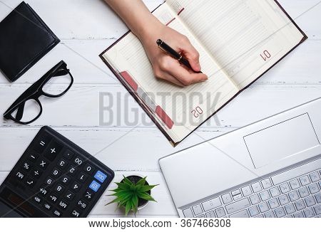 The Human Hand Writes Down Plans For Current Affairs In Daily Diary