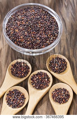 Black Quinoa Seeds - Chenopodium Petiolare. Wood Background