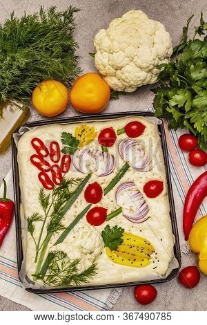 Raw Garden Focaccia. Fresh Dough And Vegetables, Olive Oil, Greens