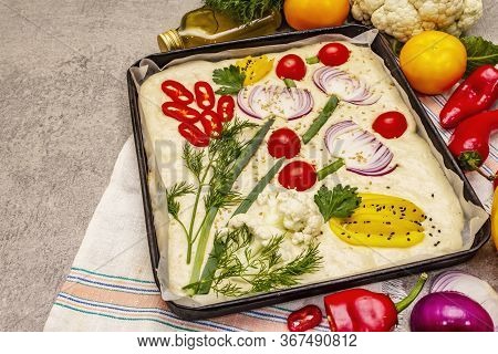 Raw Garden Focaccia. Fresh Dough And Vegetables, Olive Oil, Greens