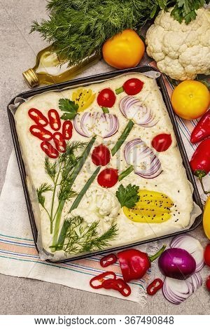 Raw Garden Focaccia. Fresh Dough And Vegetables, Olive Oil, Greens