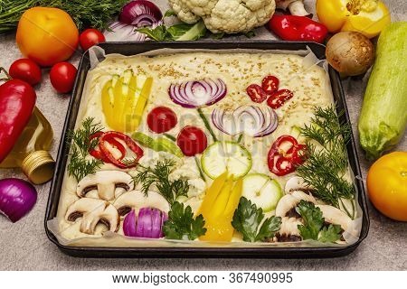 Raw Garden Focaccia. Fresh Dough And Vegetables, Olive Oil, Greens