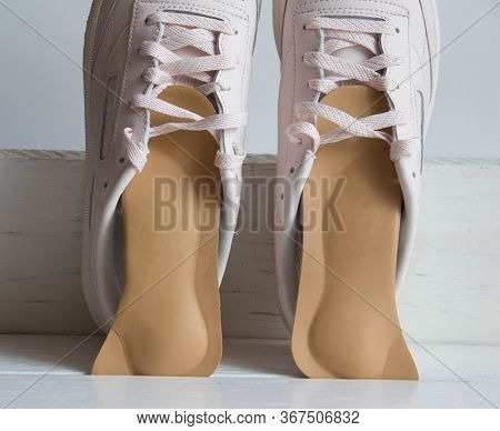 Pink Running Shoes With Orthopedic Insoles. White Background.