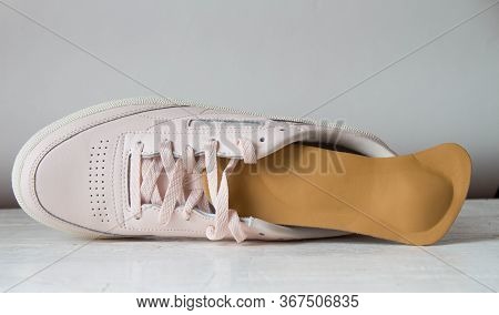 Pink Running Shoe With Orthopedic Insoles. White Background.