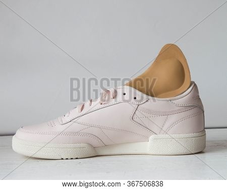 Pink Running Shoe With Orthopedic Insoles. White Background.