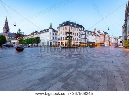 Square Amagertorv Stork Fountain In Night Lighting At Sunrise. Copenhagen. Denmark.