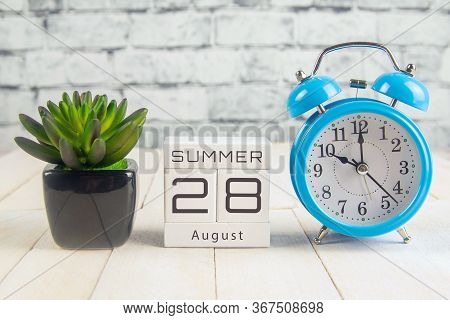 August 28 On The Wooden Calendar.the Twenty-eighth Day Of The Summer Month, A Calendar For The Workp