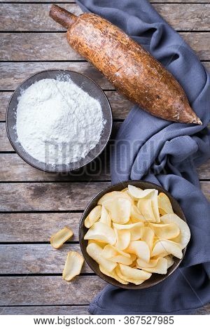 Brazilian Cuisine Food, Latin Snack. Yucca, Yuca, Cassava, Manioca Chips And Flour On A Table. Top V
