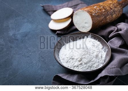 Brazilian Cuisine Food, Latin Snack. Yucca, Yuca, Cassava, Manioca Flour On A Table. Copy Space Back