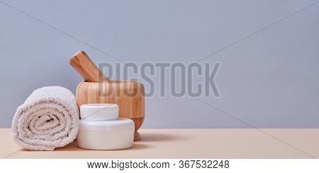 White Towel And Equipment For Relax. Spa. Wellness Concept. Selfcare. Copy Space. Isolated On Pink A