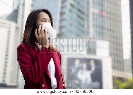 Asian Girl  Call A Telephone Use A Protection Mask For Prevent Pm 2.5 And Corona Viruus Or Covic 19 