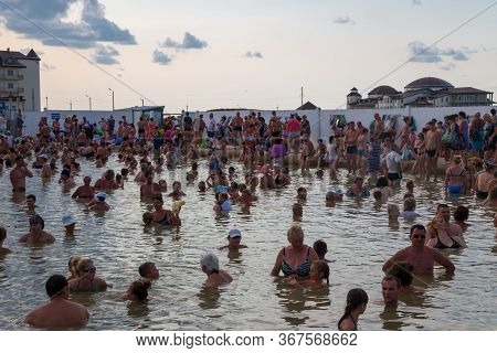 Arabat Spit, Ukraine - August 23, 2017: Unknown People Bathe In Thermal Radon Source