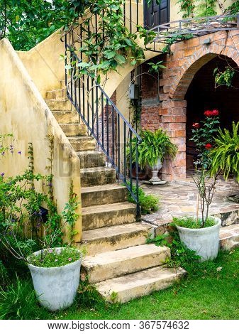 House Frontyard Cultured Veneer Stone Work Siding And Rod Iron Stairs