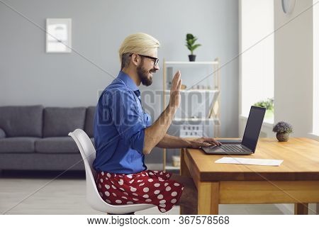 Half Dressed Employee Guy Greeting Online Colleague In Living Room.
