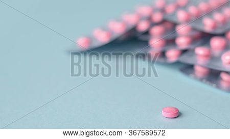 Pills Pink In A Pack On A Blue Background