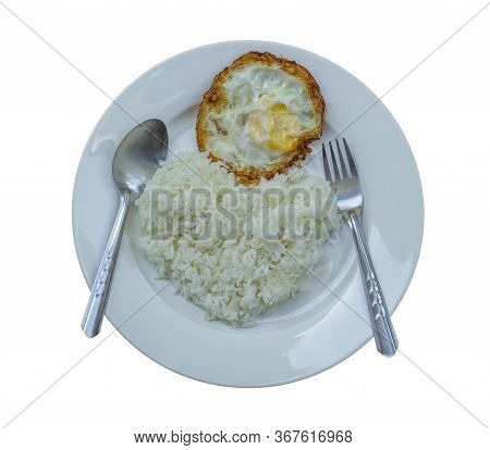 Fried Crispy Egg On Parboiled Rice In A Separate White Plate On A White Background. Heart Shaped Ric