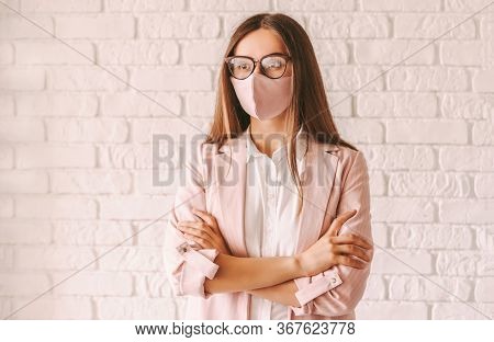 Portrait Young Professional Business Woman Boss In Eyglasses Wearing Pink Medical Face Mask. Beautif