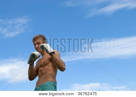 Young Guy In Boxing Gloves
