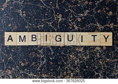 Text The Word Ambiguity From Gray Wooden Small Letters With Black Font