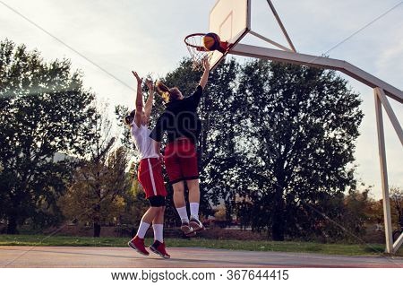 Woman Basketball Player Have Treining And Exercise At Basketball Court At City On Street