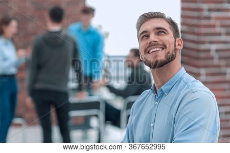 Cheerful man smiling in office.