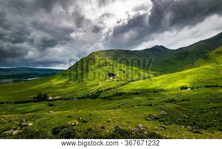 Scottish Highlands Summer Landscape In Glen Strae. Green Valley With Dramatic Storm Clouds Near Dalm