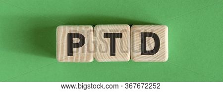 Ptd Text Concept On Wooden Beige Cubes On A Green Background
