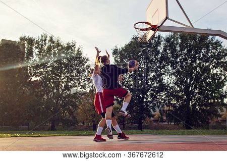 Woman Basketball Player Have Treining And Exercise At Basketball Court At City On Street